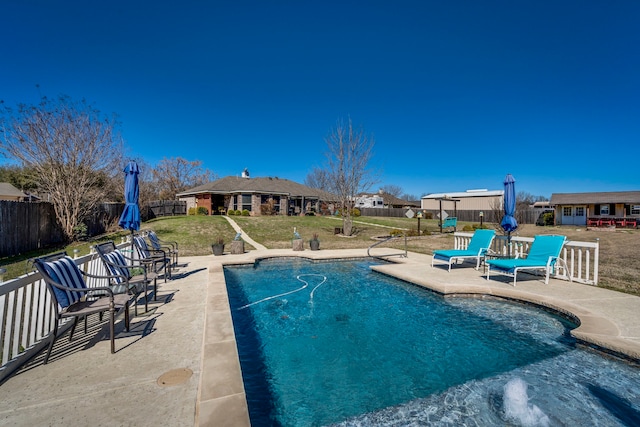 view of swimming pool featuring a patio, a lawn, a fenced backyard, and a fenced in pool