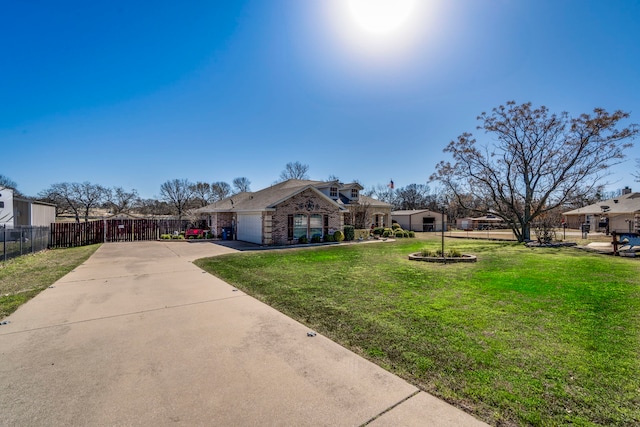 view of front of house with a garage, brick siding, fence, driveway, and a front lawn