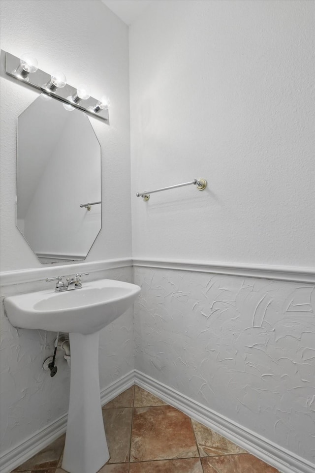 bathroom with tile patterned flooring