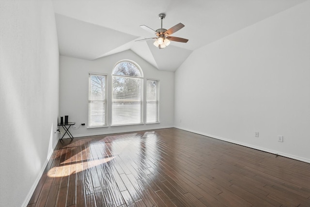 unfurnished living room featuring dark wood-type flooring, lofted ceiling, ceiling fan, and baseboards