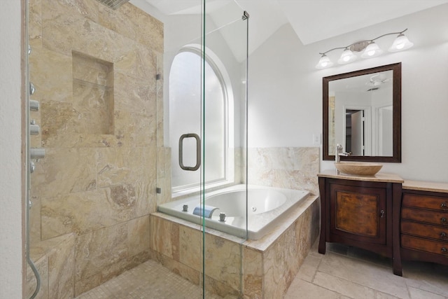 bathroom with a stall shower, vanity, and a bath