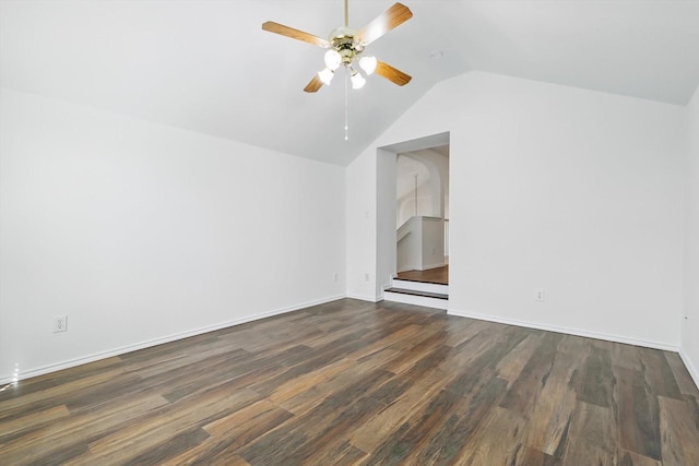 spare room with vaulted ceiling, ceiling fan, dark wood finished floors, and baseboards