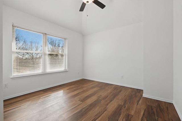 unfurnished room with lofted ceiling, baseboards, a ceiling fan, and wood finished floors