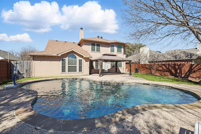 view of swimming pool with a fenced in pool, a fenced backyard, a patio, and a gazebo