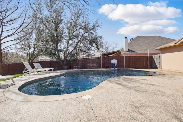 view of pool with a fenced in pool, a fenced backyard, and a patio