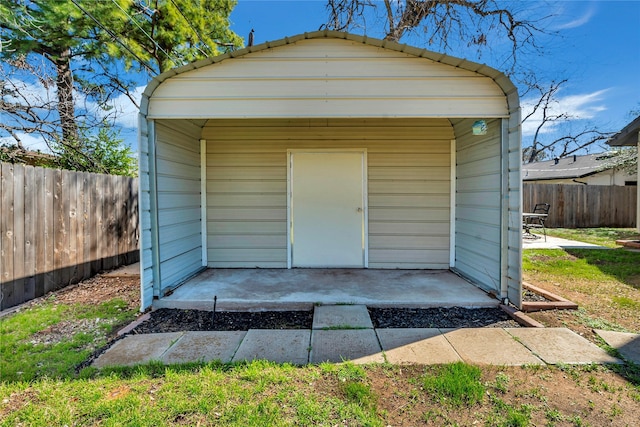 garage with fence