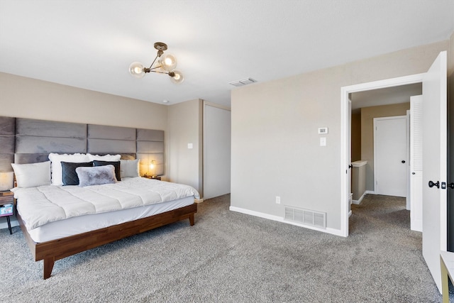 carpeted bedroom with visible vents, baseboards, and an inviting chandelier