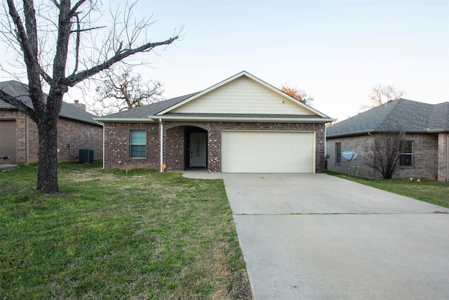 ranch-style home featuring a garage, driveway, a front yard, central AC, and brick siding