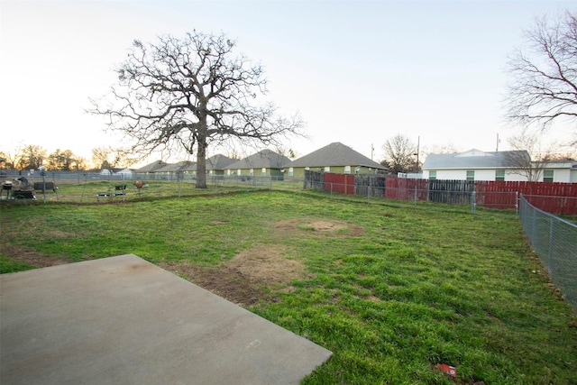 view of yard with a patio and fence