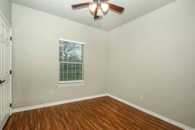 empty room with a ceiling fan, baseboards, and wood finished floors