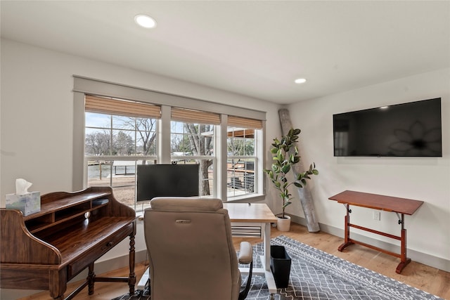 home office featuring baseboards, wood finished floors, and recessed lighting