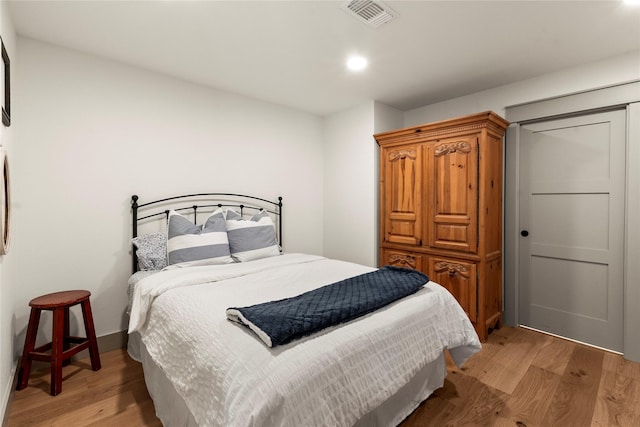 bedroom with recessed lighting, visible vents, and light wood-style floors