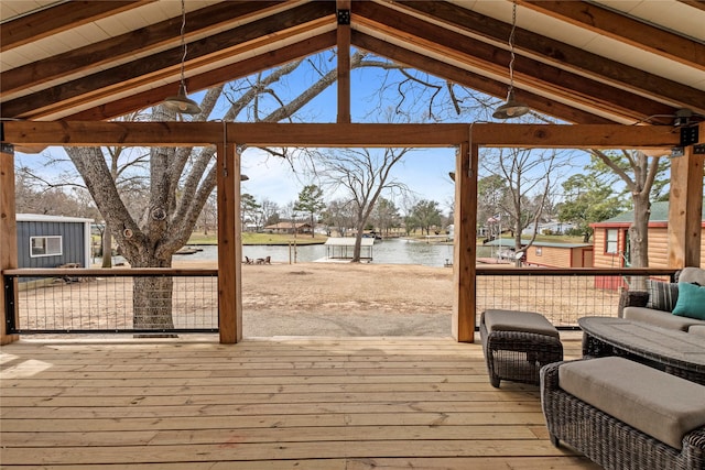 wooden deck featuring a water view