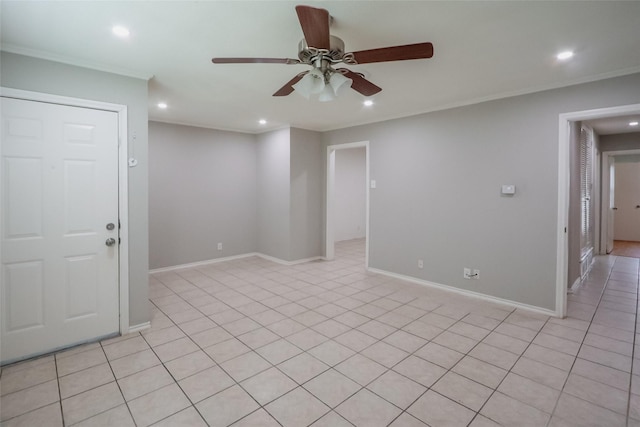 spare room with ornamental molding, recessed lighting, baseboards, and a ceiling fan