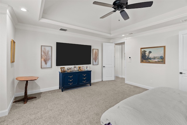 bedroom with baseboards, a raised ceiling, crown molding, and light colored carpet