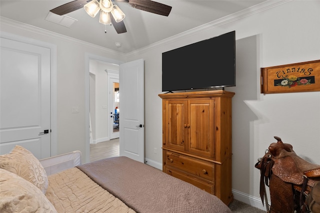 bedroom featuring ceiling fan, baseboards, and crown molding