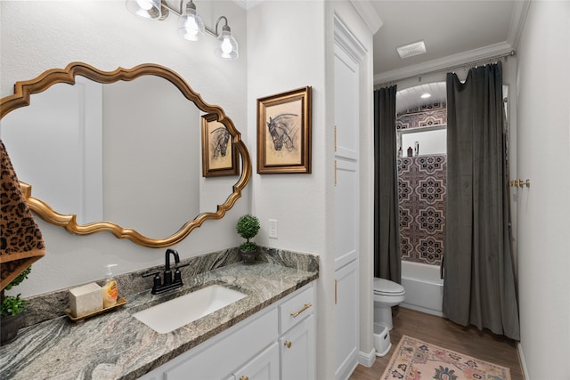 full bath with toilet, wood finished floors, vanity, ornamental molding, and shower / bath combo with shower curtain