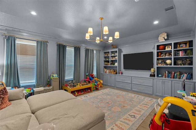 game room with light wood-style flooring, recessed lighting, visible vents, and a notable chandelier