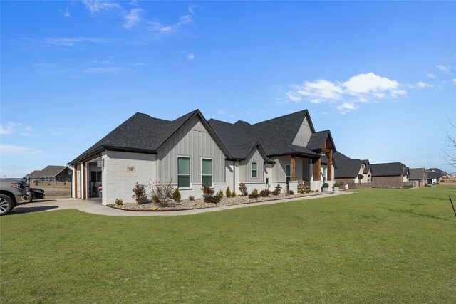 view of property exterior with board and batten siding, a shingled roof, a lawn, and concrete driveway