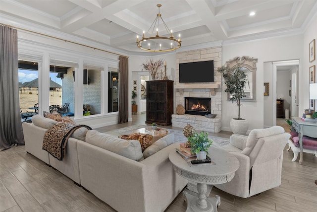 living area with a chandelier, coffered ceiling, a fireplace, wood finished floors, and beam ceiling