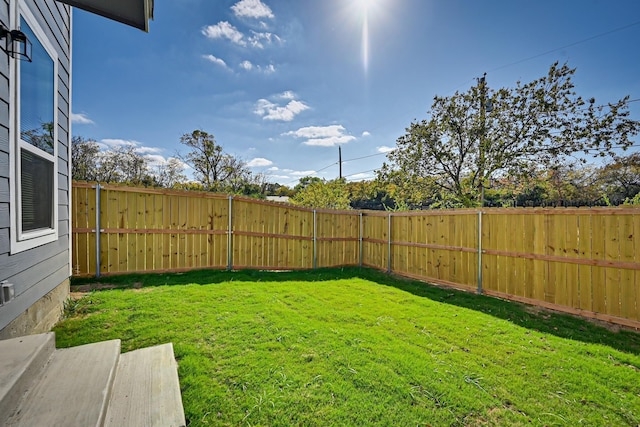 view of yard featuring a fenced backyard