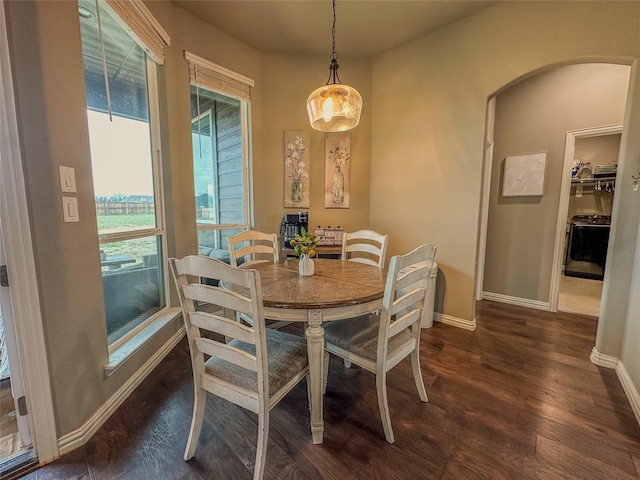 213 Stuart St, Paradise, TX 76073 - dining space featuring dark wood-style floors and arched walkways