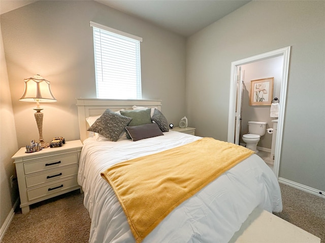 213 Stuart St, Paradise, TX 76073 - bedroom with dark carpet and connected bathroom