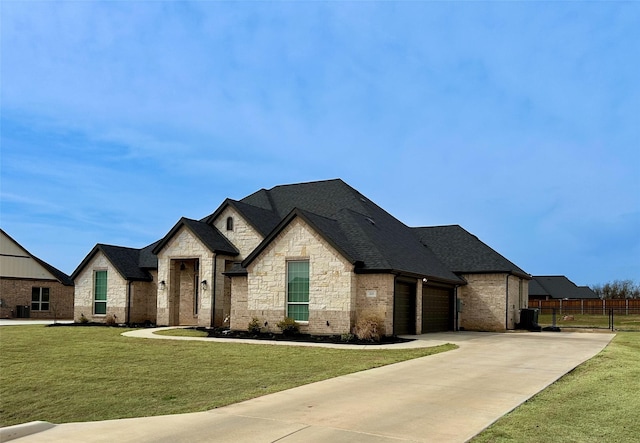 213 Stuart St, Paradise, TX 76073 - french country style house featuring driveway, roof with shingles, stone siding, a garage, and brick siding