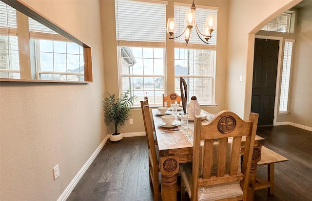 213 Stuart St, Paradise, TX 76073 - dining room with a chandelier, dark wood-style floors, and healthy amount of natural light