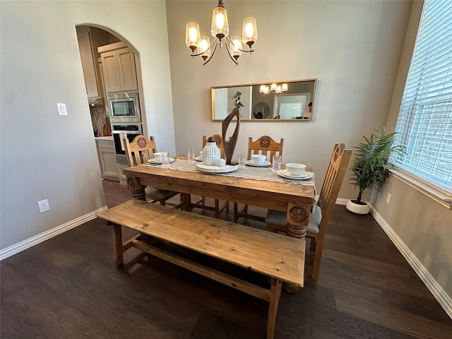 213 Stuart St, Paradise, TX 76073 - dining area with a chandelier, arched walkways, and wood finished floors