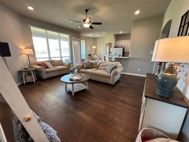 213 Stuart St, Paradise, TX 76073 - living area with a ceiling fan, dark wood-type flooring, recessed lighting, and arched walkways