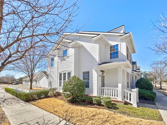 view of property exterior featuring covered porch