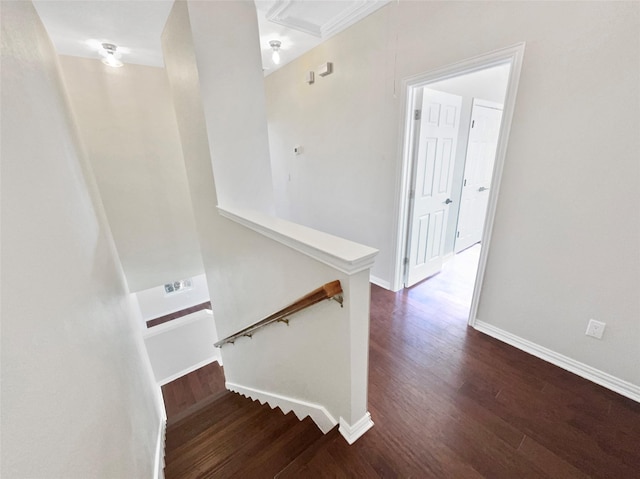 staircase featuring wood finished floors, attic access, and baseboards