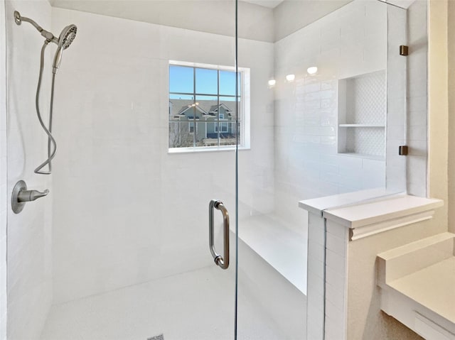 bathroom with tiled shower