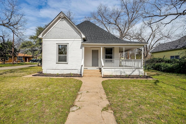 view of front of house with a porch, crawl space, a shingled roof, and a front lawn