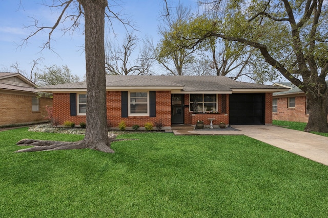 ranch-style house featuring a garage, a front yard, concrete driveway, and brick siding