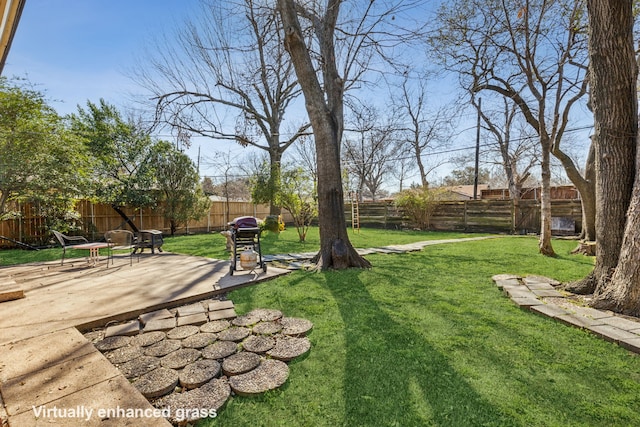 view of yard featuring a patio area and a fenced backyard