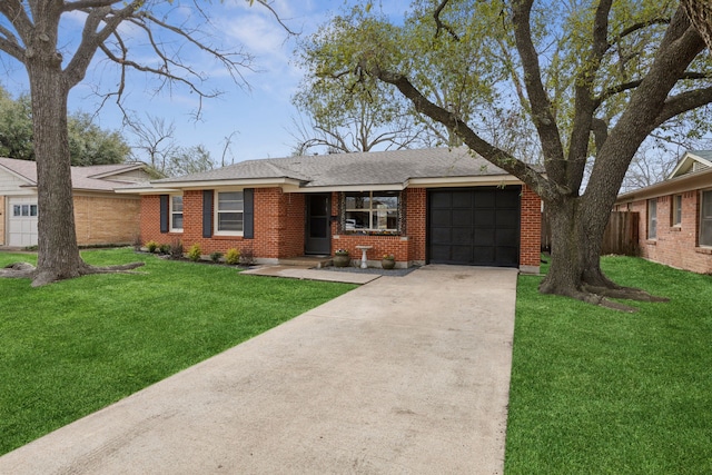 ranch-style home featuring a garage, brick siding, a shingled roof, concrete driveway, and a front lawn