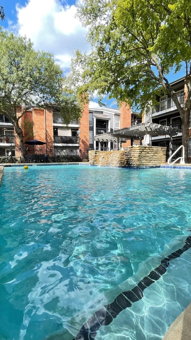 view of pool with fence