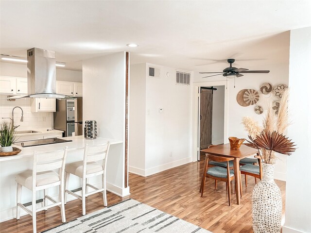 18333 Roehampton Dr Unit 123, Dallas, TX 75252 - dining space featuring baseboards, wood finished floors, recessed lighting, and ceiling fan