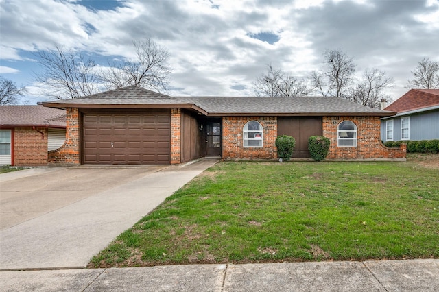 ranch-style home with a garage, brick siding, concrete driveway, roof with shingles, and a front lawn