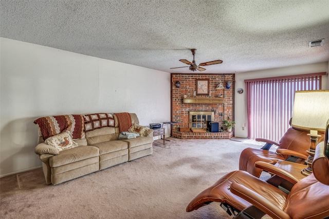 living area with carpet, visible vents, ceiling fan, and a textured ceiling