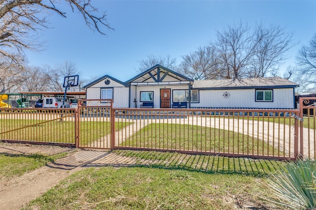 view of front of house with a fenced front yard and a front yard