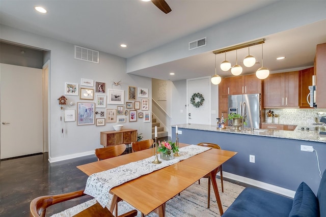 dining room featuring baseboards, stairs, visible vents, and recessed lighting