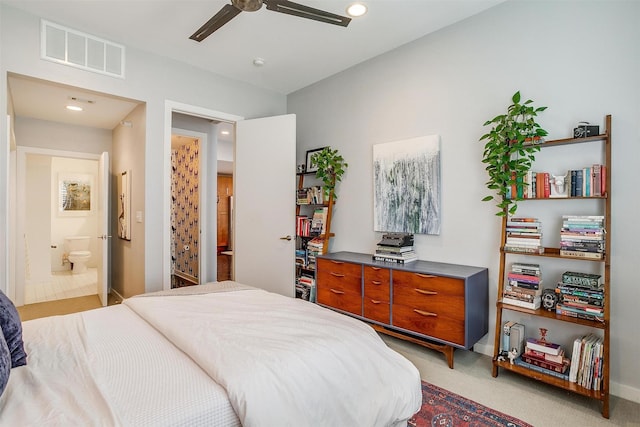 bedroom with light carpet, baseboards, visible vents, ensuite bath, and recessed lighting