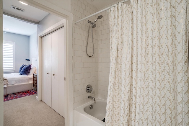 bathroom featuring shower / tub combo, visible vents, and connected bathroom