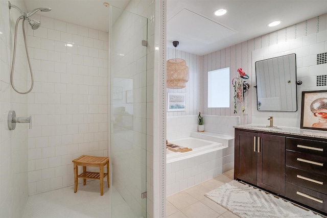 bathroom with recessed lighting, a stall shower, vanity, tile patterned flooring, and a bath