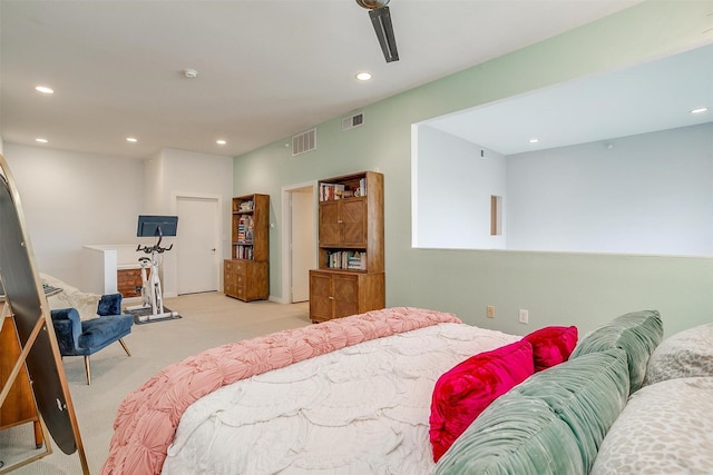 carpeted bedroom with visible vents and recessed lighting