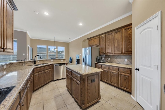 1741 Pine Dr, Midlothian, TX 76065 - kitchen with stainless steel appliances, a sink, backsplash, light stone countertops, and crown molding
