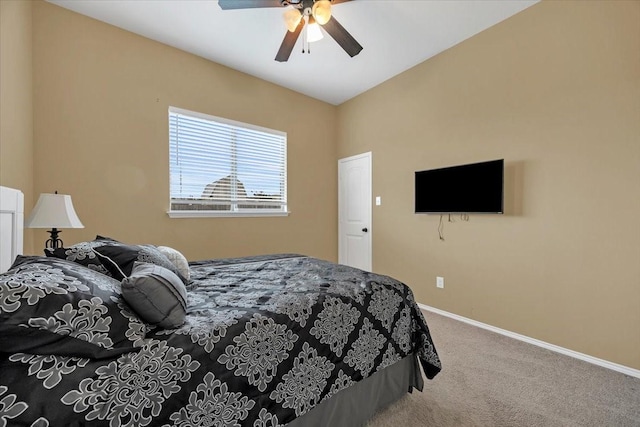 carpeted bedroom with baseboards and a ceiling fan